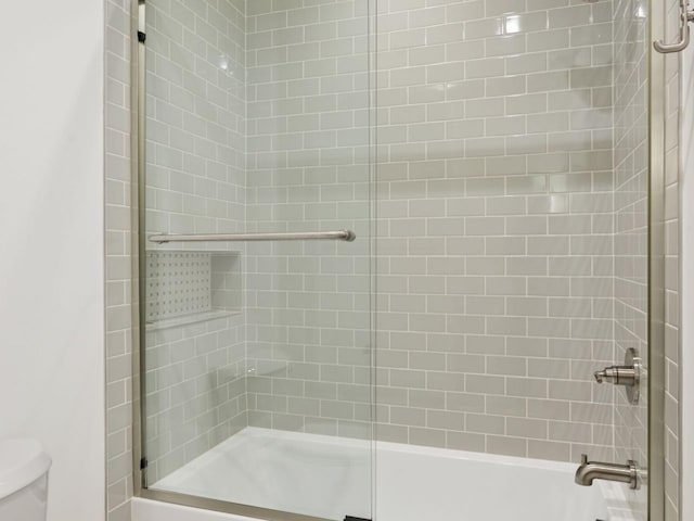 5010 Millie Rd SW, Rochester, MN 55902 - bathroom with a washtub, a shower with door, and toilet