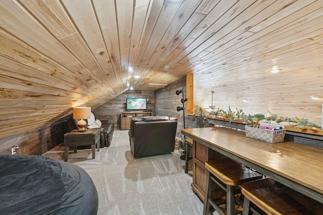 interior space featuring lofted ceiling, light colored carpet, wooden walls, and wooden ceiling