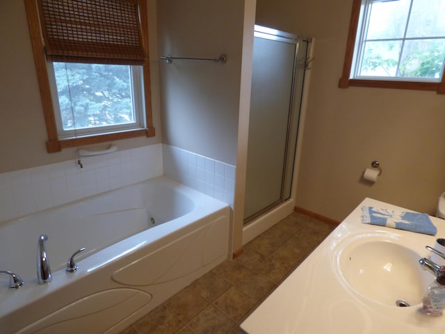1907 Red Maple Ln, Northfield, MN 55057 - bathroom with a whirlpool tub, a stall shower, and tile patterned floors