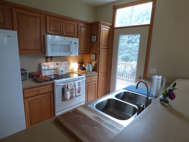 1907 Red Maple Ln, Northfield, MN 55057 - kitchen featuring white appliances, light countertops, and brown cabinets