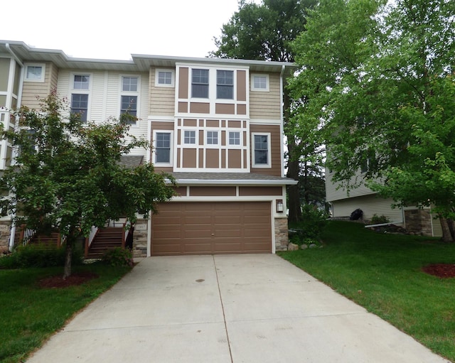 1907 Red Maple Ln, Northfield, MN 55057 - view of front of home featuring stone siding, driveway, an attached garage, and a front yard