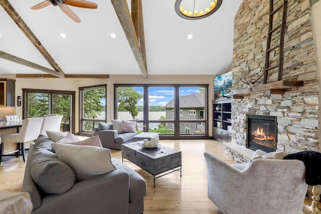 3420 Fairview Ave N, Arden Hills, MN 55112 - living area featuring healthy amount of natural light, beam ceiling, high vaulted ceiling, light wood-style floors, and a ceiling fan