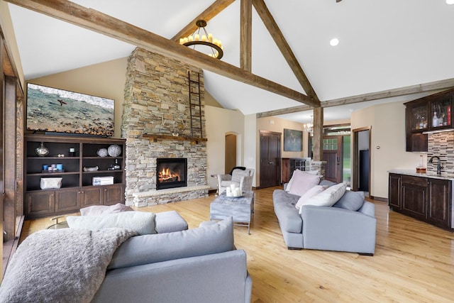 3420 Fairview Ave N, Arden Hills, MN 55112 - living room with beamed ceiling, high vaulted ceiling, a fireplace, light wood-style floors, and bar area