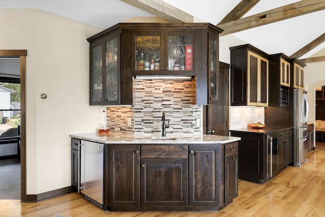 3420 Fairview Ave N, Arden Hills, MN 55112 - indoor wet bar with stainless steel fridge with ice dispenser, beverage cooler, light wood finished floors, backsplash, and baseboards