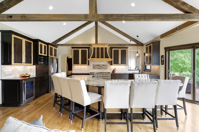 3420 Fairview Ave N, Arden Hills, MN 55112 - kitchen with beverage cooler, stainless steel appliances, custom exhaust hood, a spacious island, and tasteful backsplash