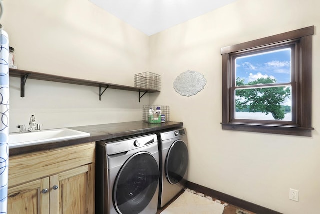 3420 Fairview Ave N, Arden Hills, MN 55112 - laundry area featuring washing machine and dryer, cabinet space, and baseboards