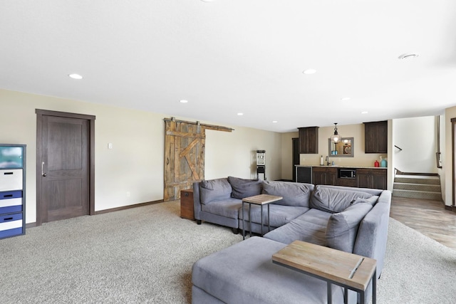 3420 Fairview Ave N, Arden Hills, MN 55112 - living area featuring a barn door, recessed lighting, stairs, bar, and light colored carpet