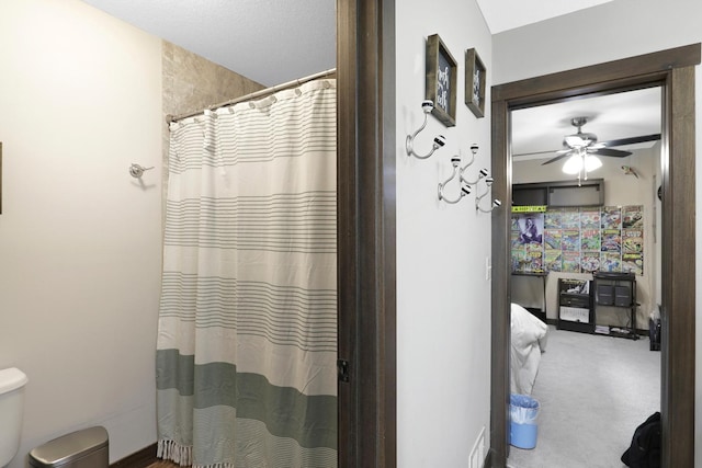 3420 Fairview Ave N, Arden Hills, MN 55112 - bathroom with toilet, ceiling fan, and a shower with shower curtain