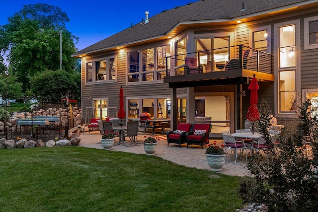 3420 Fairview Ave N, Arden Hills, MN 55112 - rear view of property featuring a balcony, a patio, a lawn, and a shingled roof