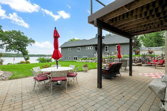 3420 Fairview Ave N, Arden Hills, MN 55112 - view of patio featuring outdoor dining area and a water view