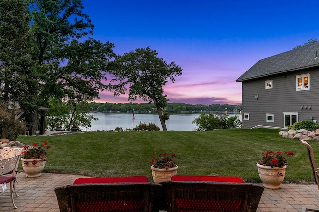 3420 Fairview Ave N, Arden Hills, MN 55112 - yard at dusk with a yard, a water view, and a patio area