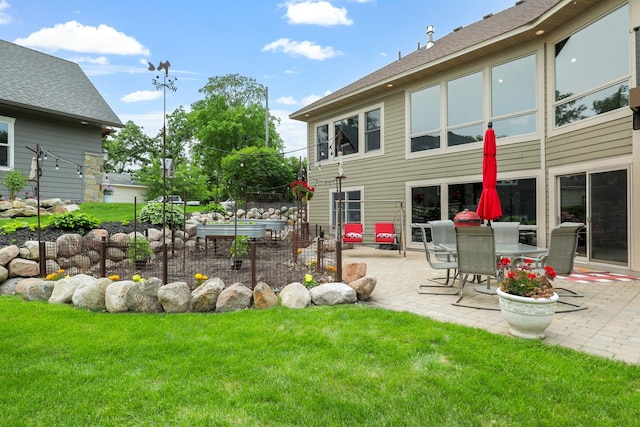3420 Fairview Ave N, Arden Hills, MN 55112 - view of green lawn with a patio
