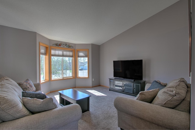 living room featuring baseboards, carpet, and vaulted ceiling