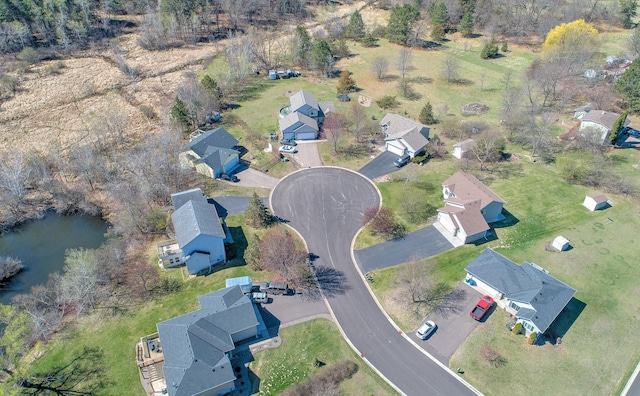 bird's eye view with a water view and a residential view