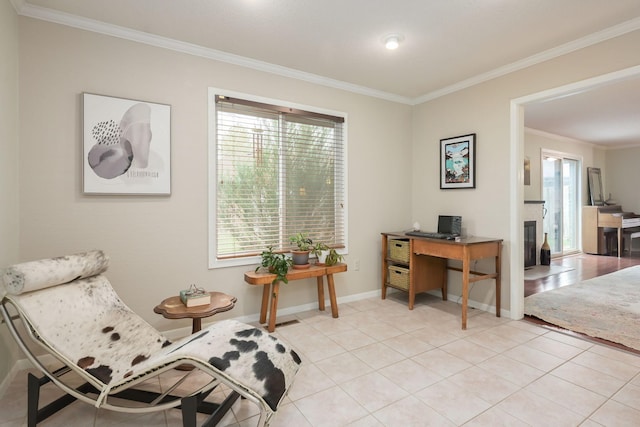sitting room featuring ornamental molding, an office area, baseboards, and light tile patterned flooring