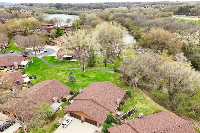 aerial view of residential area featuring a large body of water
