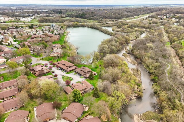 aerial overview of property's location featuring nearby suburban area and a large body of water