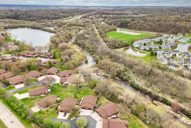aerial view of property's location featuring nearby suburban area and a nearby body of water