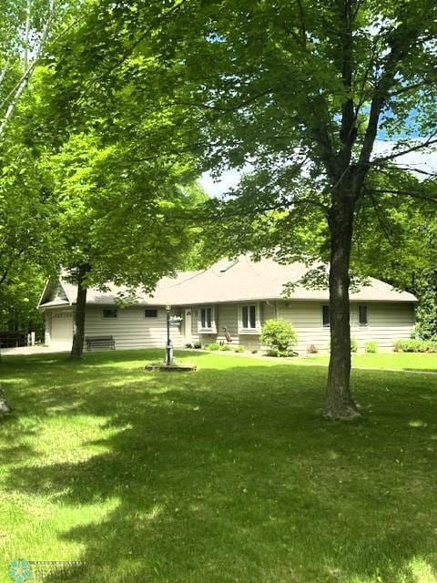 38227 County Highway 34, Maple Grove Twp, MN 56569 - rear view of property with a lawn and an attached garage