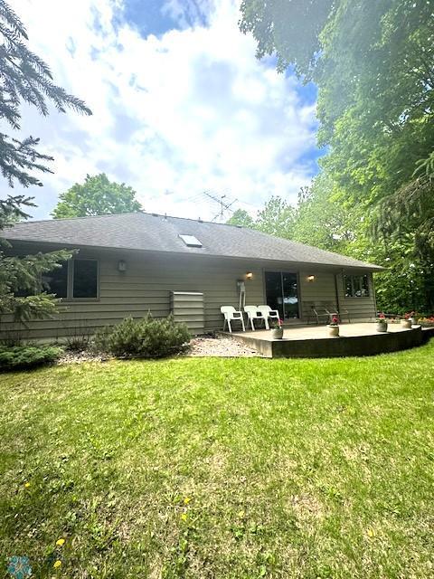 38227 County Highway 34, Maple Grove Twp, MN 56569 - rear view of house featuring a lawn and a patio area