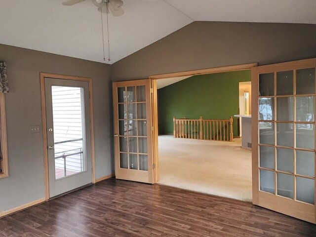 doorway to outside with baseboards, ceiling fan, wood finished floors, and lofted ceiling