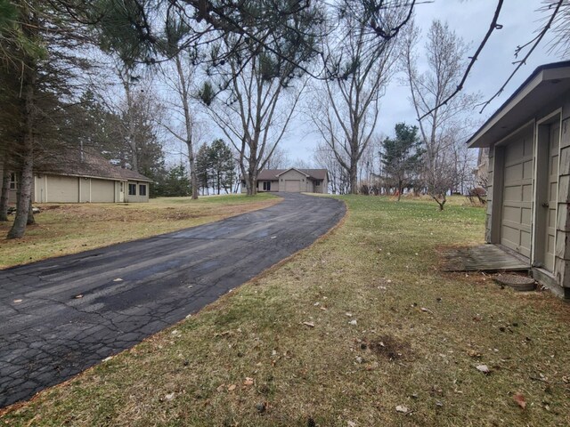 view of street with aphalt driveway