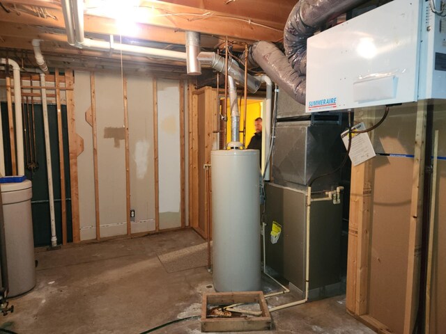 utility room featuring gas water heater
