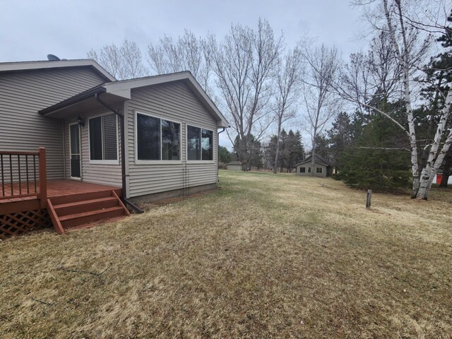 view of yard with a wooden deck