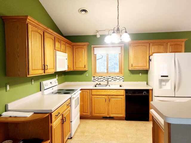 kitchen with an inviting chandelier, visible vents, white appliances, light countertops, and a sink