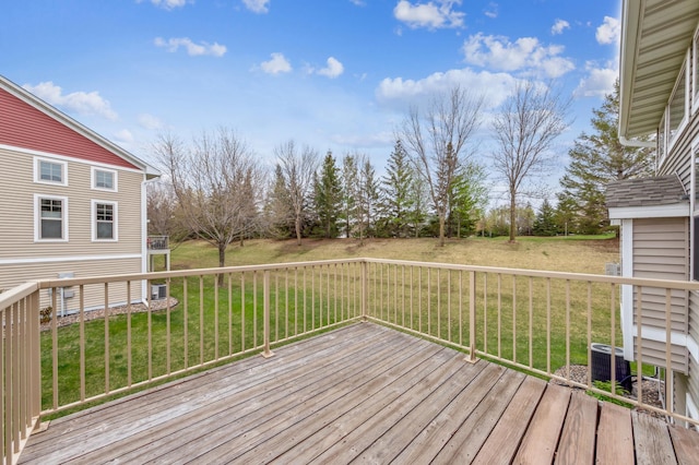 wooden terrace with a yard