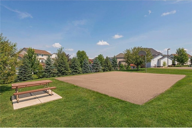 view of home's community featuring a lawn and a residential view