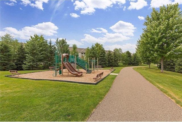communal playground featuring a yard