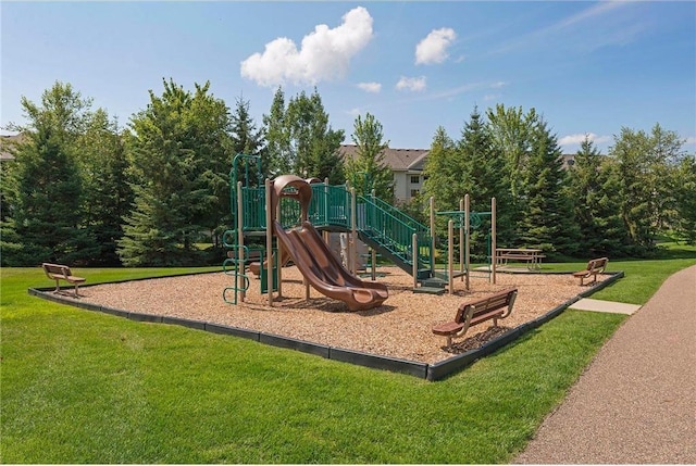 communal playground featuring a yard