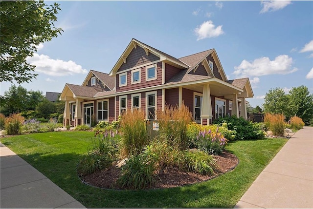 view of property exterior featuring a lawn and roof with shingles