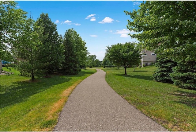 view of home's community featuring a lawn