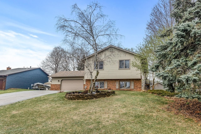 split level home with brick siding, a garage, a front lawn, and aphalt driveway