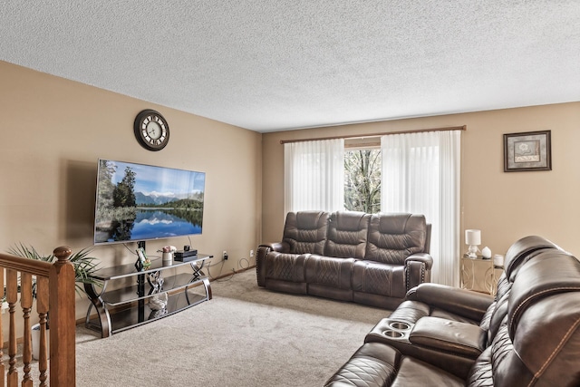 carpeted living room featuring a textured ceiling