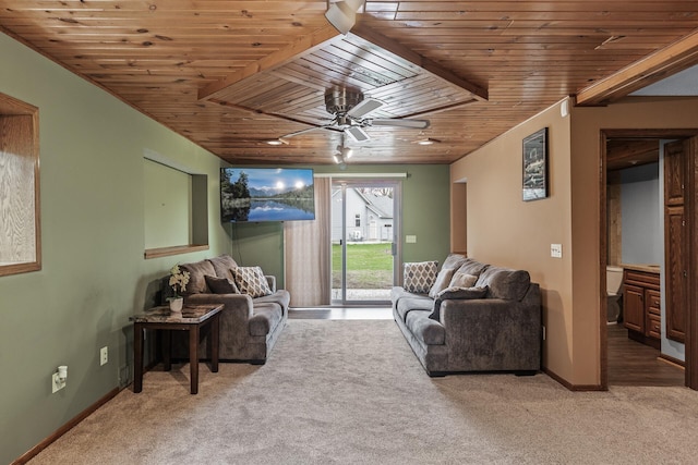 living room featuring carpet flooring, ceiling fan, baseboards, and wood ceiling