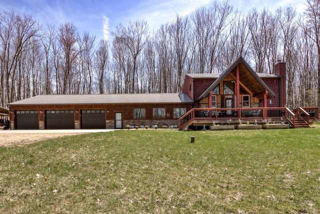 546 315th St, Cady Twp, WI 54749 - log-style house featuring a garage, a chimney, driveway, and a front yard