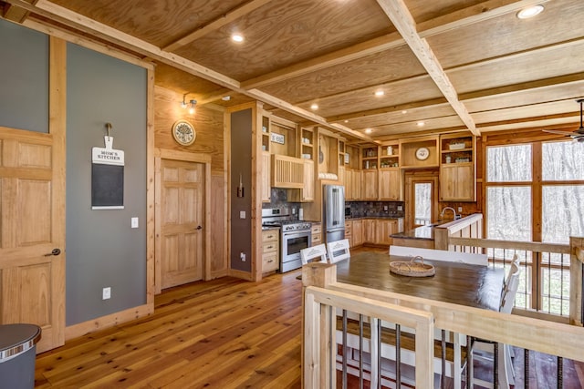546 315th St, Cady Twp, WI 54749 - dining area featuring ceiling fan, light wood-type flooring, baseboards, beamed ceiling, and recessed lighting