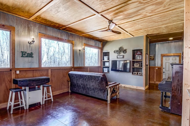 546 315th St, Cady Twp, WI 54749 - living area featuring wooden walls, ceiling fan, wooden ceiling, and a healthy amount of sunlight