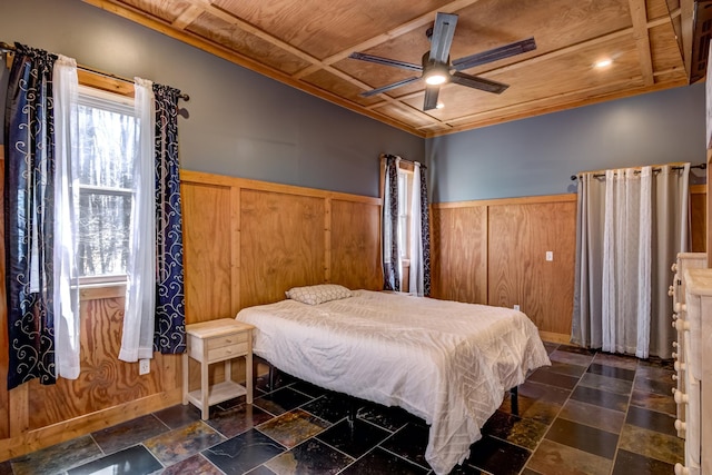 546 315th St, Cady Twp, WI 54749 - bedroom featuring stone tile floors, a wainscoted wall, and wooden walls
