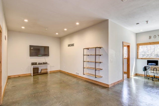 546 315th St, Cady Twp, WI 54749 - unfurnished living room featuring baseboards, recessed lighting, concrete flooring, and visible vents