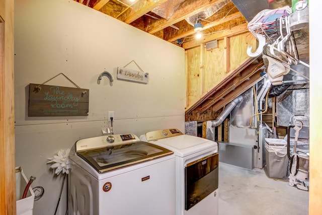 546 315th St, Cady Twp, WI 54749 - laundry room with laundry area, heating unit, and washing machine and dryer