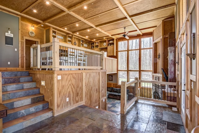 546 315th St, Cady Twp, WI 54749 - interior space featuring stone tile floors, coffered ceiling, ceiling fan, and beamed ceiling