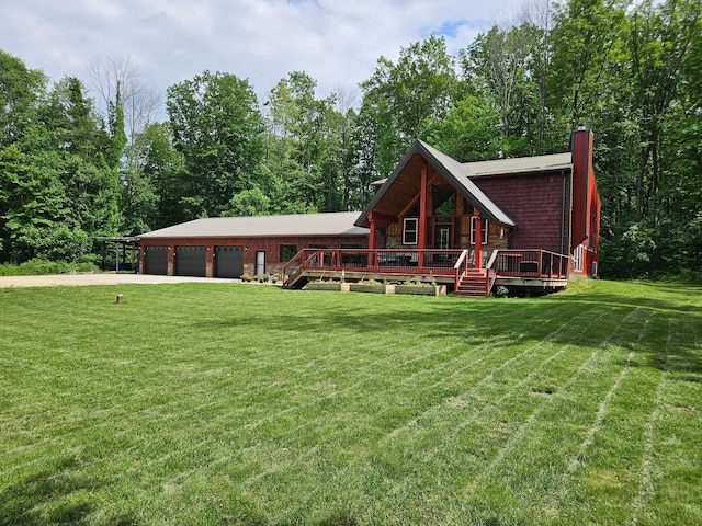546 315th St, Cady Twp, WI 54749 - view of front facade featuring a chimney, concrete driveway, a front lawn, a deck, and a garage