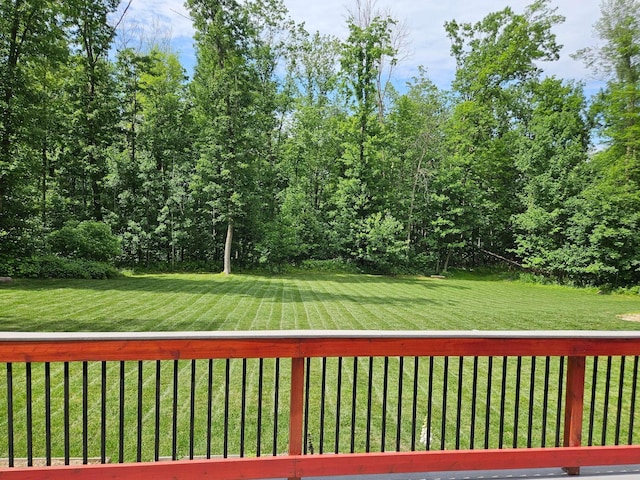 546 315th St, Cady Twp, WI 54749 - wooden deck featuring a yard
