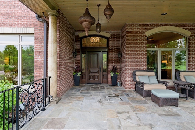 7250 Jubert Ln, Corcoran, MN 55340 - doorway to property featuring brick siding and a patio