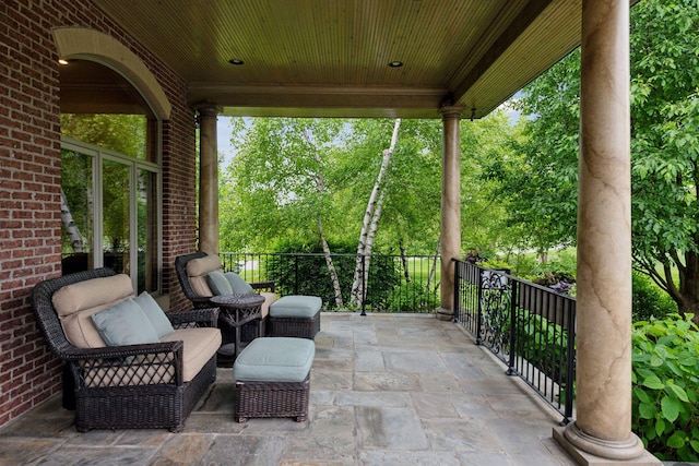 7250 Jubert Ln, Corcoran, MN 55340 - view of patio / terrace featuring view of wooded area