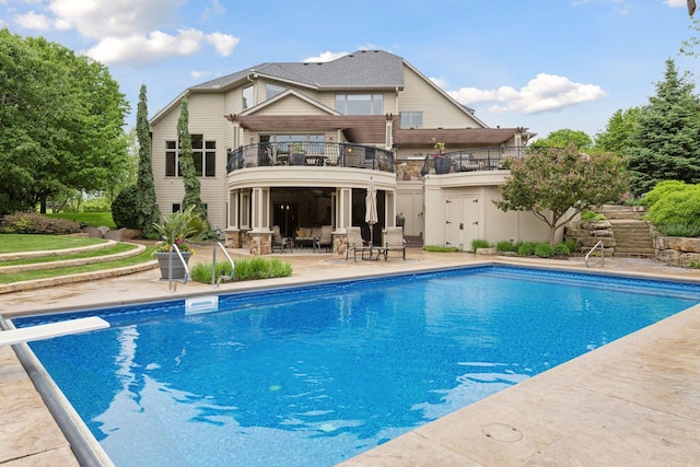 7250 Jubert Ln, Corcoran, MN 55340 - back of property featuring a balcony, a patio, and an outdoor pool